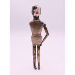 A silver and enamel peg doll form pepperette, inscribed Frank Hyams Ltd, 128 New Bond St, W. 10.