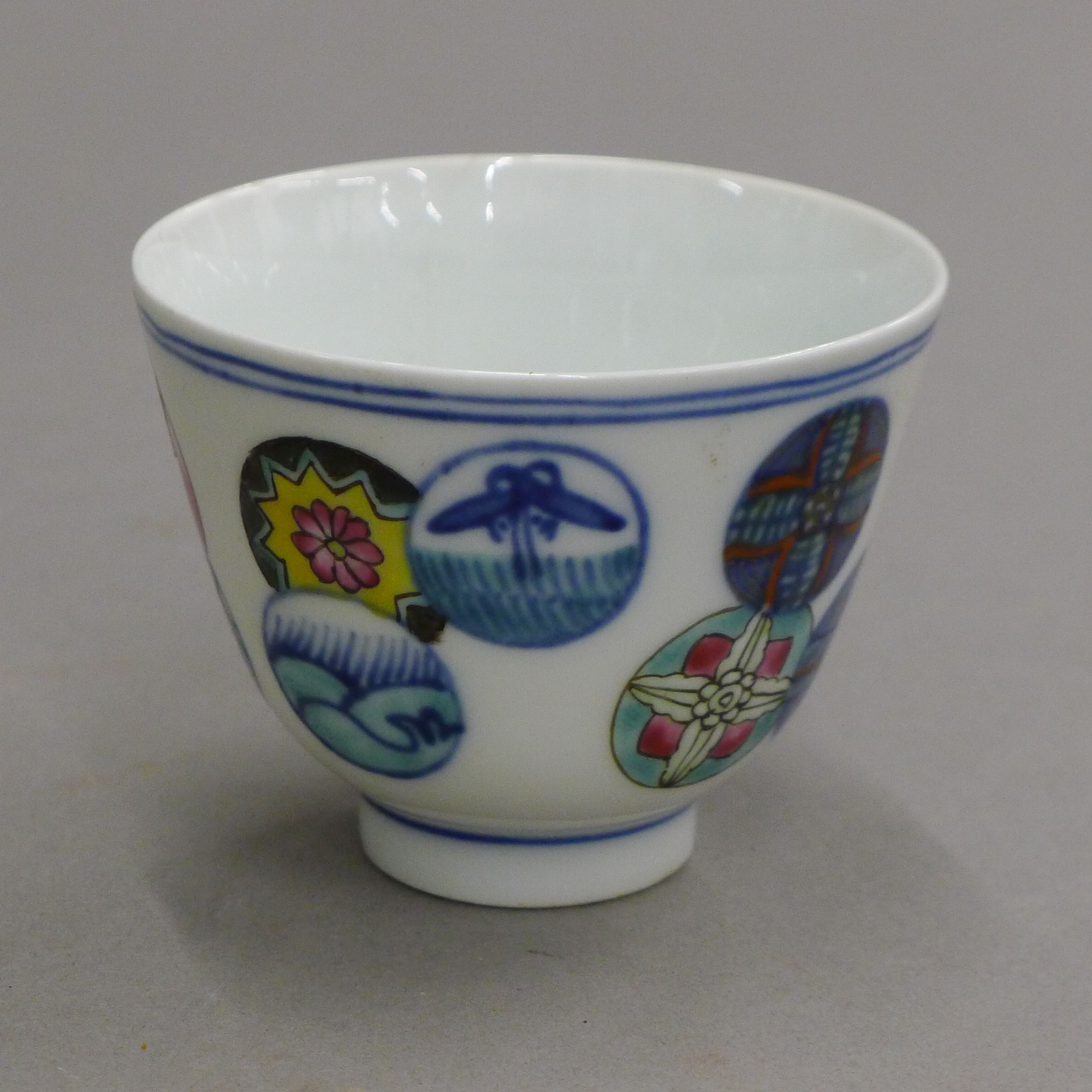 A Chinese porcelain tea bowl decorated with circles. 7.5 cm diameter.