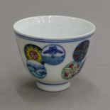 A Chinese porcelain tea bowl decorated with circles. 7.5 cm diameter.