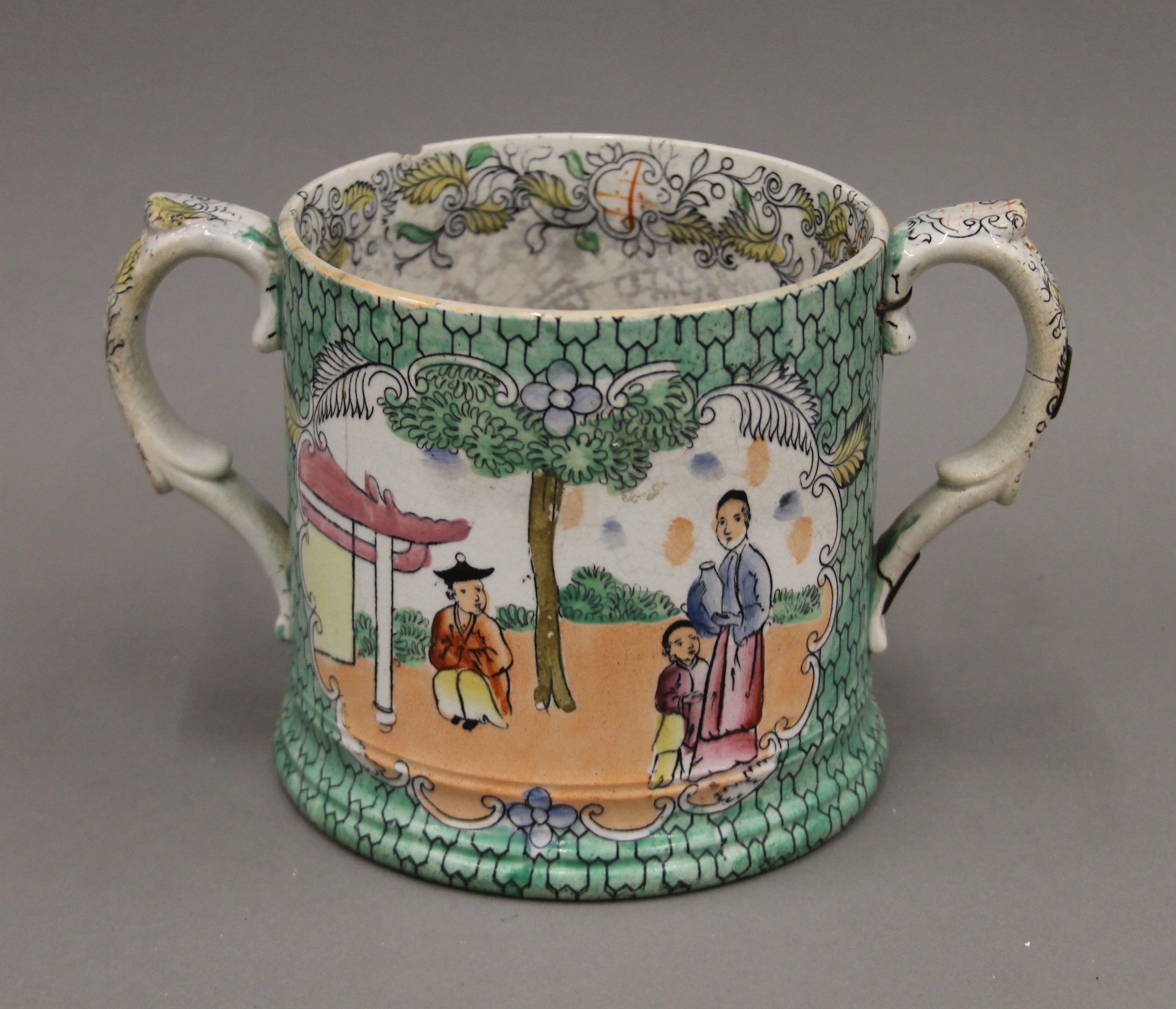 A late 18th/early 19th century English loving cup in the chinoiserie style,