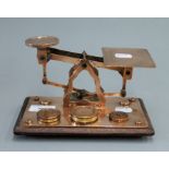 A 19th century set of copper postal scales. 19.5 cm wide.