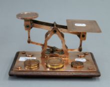 A 19th century set of copper postal scales. 19.5 cm wide.