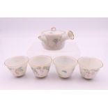 A Chinese miniature five piece porcelain tea set. The tea pot 6.5 cm wide.