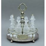 An eight piece silver plated cruet stand. 35 cm high.