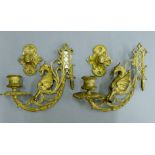 A pair of gilded brass candle sconces.