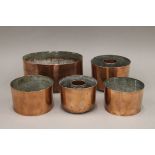 Five 19th century copper pudding moulds.