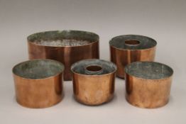 Five 19th century copper pudding moulds.