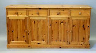 A modern four drawer pine dresser base. 173 cm wide, 47 cm deep.