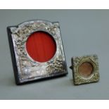 Two small silver photograph frames. The largest 8.5 x 9 cm.