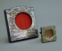 Two small silver photograph frames. The largest 8.5 x 9 cm.