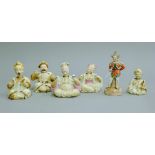 A collection of 19th century porcelain nodding head figures. The largest 14 cm high.