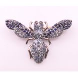 A gold backed and silver brooch formed as a bee. 3.5 x 2.25 cm.