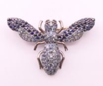 A gold backed and silver brooch formed as a bee. 3.5 x 2.25 cm.