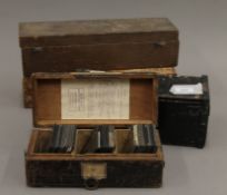 Four boxes of antique magic lantern slides.