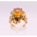 A Contemporary citrine set gold ring, possibly 15 ct gold. Ring size J/K. 9.4 grammes total weight.