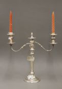 A silver plate three branch candelabra. 38.5 cm high.