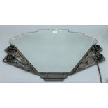 An Art Deco mirror with floral decoration. 79 cm wide.