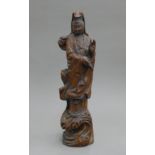 A carved model of Guanyin. 39.5 cm high.