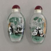 A pair of snuff bottles decorated with Pandas. 8 cm high.