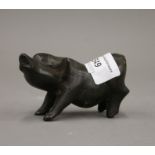 A bronze model of a pig. 9 cm long.