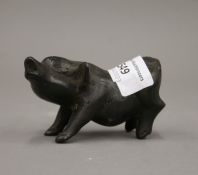 A bronze model of a pig. 9 cm long.