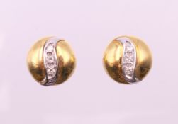 A pair of gold and diamond earrings. 1 cm diameter. 5.3 grammes total weight.