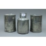 Three Chinese pewter tea caddies. The largest 19 cm high.