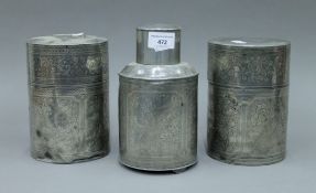 Three Chinese pewter tea caddies. The largest 19 cm high.