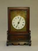 A Chinese hardwood fusee clock. 36 cm high.