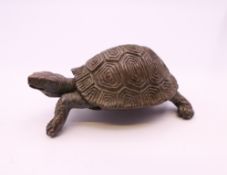 A bronze model of a tortoise. 5.5 cm long.