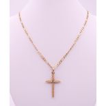 A 9 ct gold cross pendant on a 9 ct gold chain. Cross 3.5 cm high, chain 46 cm long. 7.3 grammes.