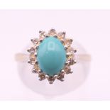 An 18 ct white gold diamond and turquoise ring. Ring size M/N.