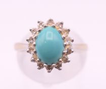 An 18 ct white gold diamond and turquoise ring. Ring size M/N.