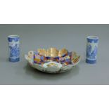 A lobed Imari charger and a pair of Japanese blue and white porcelain vases.