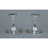 A pair of George V silver candlesticks, hallmarked for Birmingham 1917. 10 cm high.