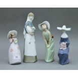 Four various Lladro figurines.