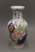 A Chinese porcelain famille rose vase painted with tobacco leaves, with square seal mark to base.