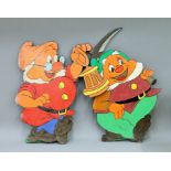 Two of Disney's Seven Dwarfs painted wooden cut outs. The largest 64 cm high.