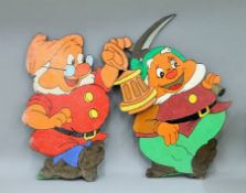 Two of Disney's Seven Dwarfs painted wooden cut outs. The largest 64 cm high.