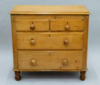 A Victorian pine two-over-two chest of drawers. 85 cm wide.
