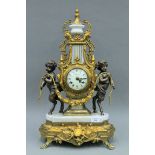 A gilt metal mounted mantle clock. 62 cm high.