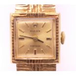 A 9 ct gold Rolex ladies precision wristwatch (in working order). 1.5 cm square. 31.