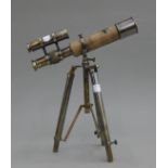 A small telescope on stand. 25.5 cm long.