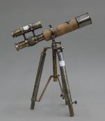 A small telescope on stand. 25.5 cm long.