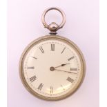 A silver pocket watch. 3.75 cm diameter.