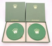 Two Rolex coasters, boxed.