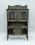 A Victorian carved oak side cabinet. 95 cm wide.