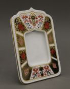 A boxed Royal Crown Derby photograph frame, numbered 1128 MMI. 17.5 cm high.