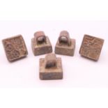 Five bronze seals. Each approximately 2 cm high.