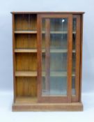 A late 19th/early 20th century oak glazed bookcase. 85.5 cm wide.